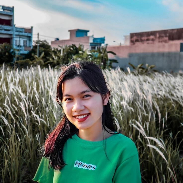 Avery Chen, Lead Design Curator at Celestial Growth Hub, reviewing corporate floral arrangements